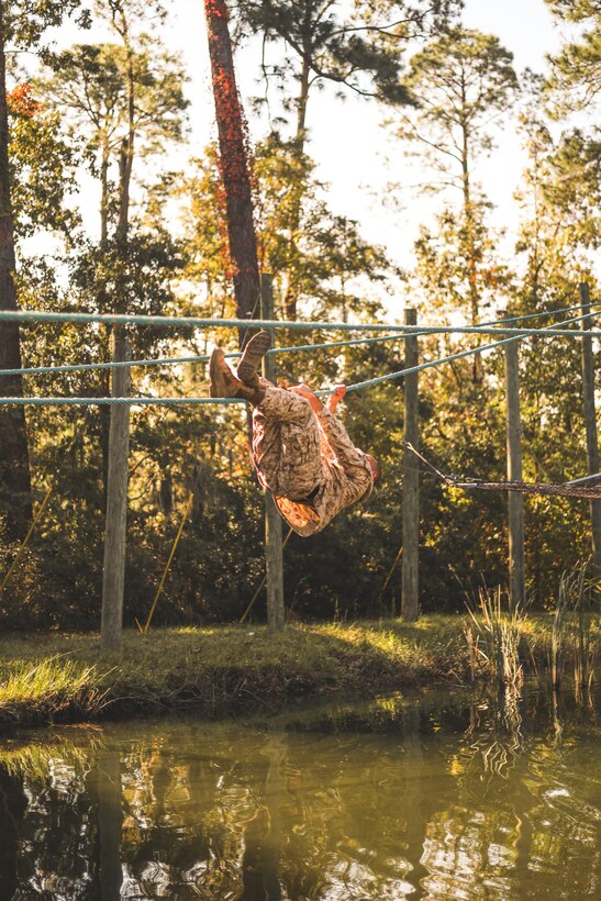 U.S. Marine Corps Staff Sgt. Alexander Sotoacevedo, network chief, Marine Aircraft Group 31, 2nd Marine Aircraft Wing, participates in the confidence course at Marine Corps Recruit Depot Parris Island, South Carolina, Oct. 25, 2024. The confidence course is an obstacle course designed to build physical fitness, teamwork, and mental resilience among Marines. (U.S. Marine Corps photo by Cpl. Mason Coots)