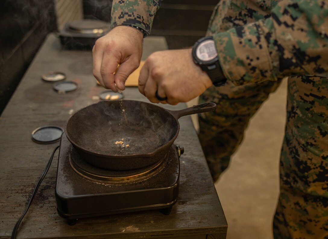 U.S. Marines with Marine Wing Support Squadron 273, Marine Air Control Group 28, 2nd Marine Aircraft Wing, prepare the CS gas for their annual Chemical, Biological, Radiological, and Nuclear Defense training on Marine Corps Air Station Beaufort, South Carolina, Dec. 19, 2024. The gas chamber is a controlled environment in which a non-lethal gas is released, training Marines to have confidence in their gear and become familiar with the effects of the gas. (U.S. Marine Corps photo by Lance Cpl. Isabella Renaud)