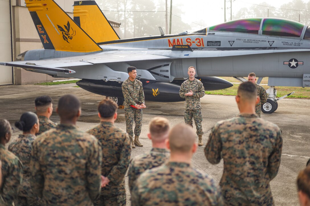 U.S. Marine Corps Sgt. Monireach Seng, aircraft intermediate structure mechanic, Marine Aviation Logistics Squadron 31, Marine Aircraft Group 31, 2nd Marine Aircraft Wing, speaks to Marines after being promoted to the rank of Sergeant at Marine Corps Air Station Beaufort, South Carolina, Feb. 3, 2025. In the Marine Corps, the rank of Sergeant is a crucial leadership position, signifying increased responsibility for training, mentoring, and leading Marines while upholding the Corps' high standards of discipline and professionalism. (U.S. Marine Corps photo by Cpl. Mason Coots)