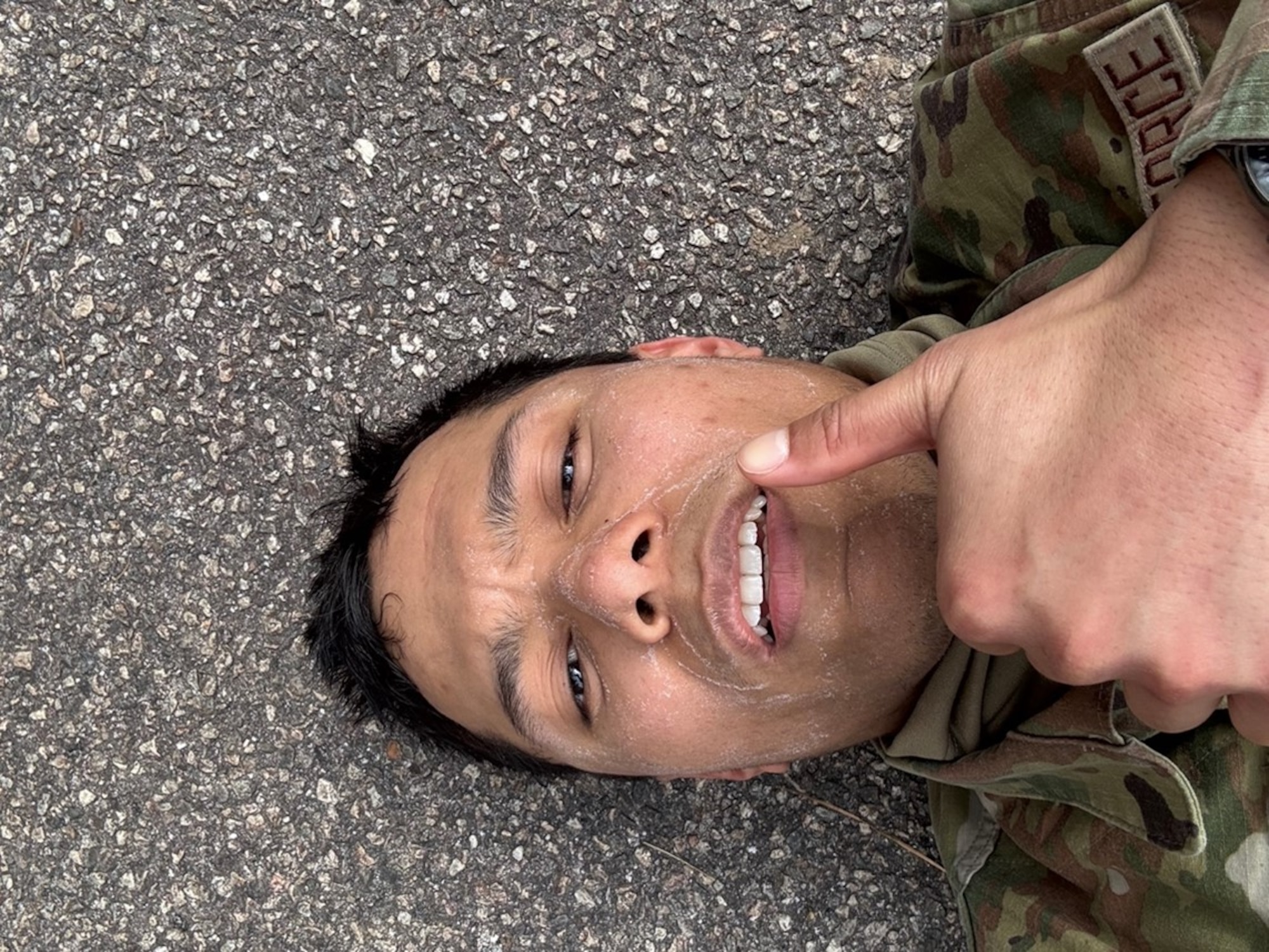 Airman gives thumbs up from the floor. (U.S. Air Force photo by Airman 1st Class Donnell Ramsey)