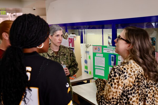 Sailors and staff at Navy Medicine Readiness and Training Command (NMRTC) Twentynine Palms showcase innovative projects aimed at enhancing patient care, streamlining operations, and improving efficiency during the 10th Annual Process Improvement Fair on March 14, 2025. The event highlighted 15 projects across multiple departments, with top honors awarded to initiatives focused on warehouse optimization, medical readiness assessments, and supply management (U.S. Navy photo by Christopher C. Jones, NHTP/NMRTC Twentynine Palms public affairs officer).