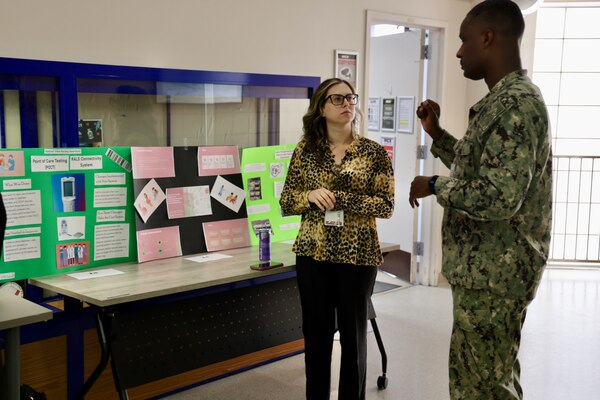 Sailors and staff at Navy Medicine Readiness and Training Command (NMRTC) Twentynine Palms showcase innovative projects aimed at enhancing patient care, streamlining operations, and improving efficiency during the 10th Annual Process Improvement Fair on March 14, 2025. The event highlighted 15 projects across multiple departments, with top honors awarded to initiatives focused on warehouse optimization, medical readiness assessments, and supply management. (U.S. Navy photo by Christopher C. Jones, NHTP/NMRTC Twentynine Palms public affairs officer).