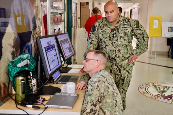 Sailors and staff at Navy Medicine Readiness and Training Command (NMRTC) Twentynine Palms showcase innovative projects aimed at enhancing patient care, streamlining operations, and improving efficiency during the 10th Annual Process Improvement Fair on March 14, 2025. The event highlighted 15 projects across multiple departments, with top honors awarded to initiatives focused on warehouse optimization, medical readiness assessments, and supply management (U.S. Navy photo by Christopher C. Jones, NHTP/NMRTC Twentynine Palms public affairs officer).