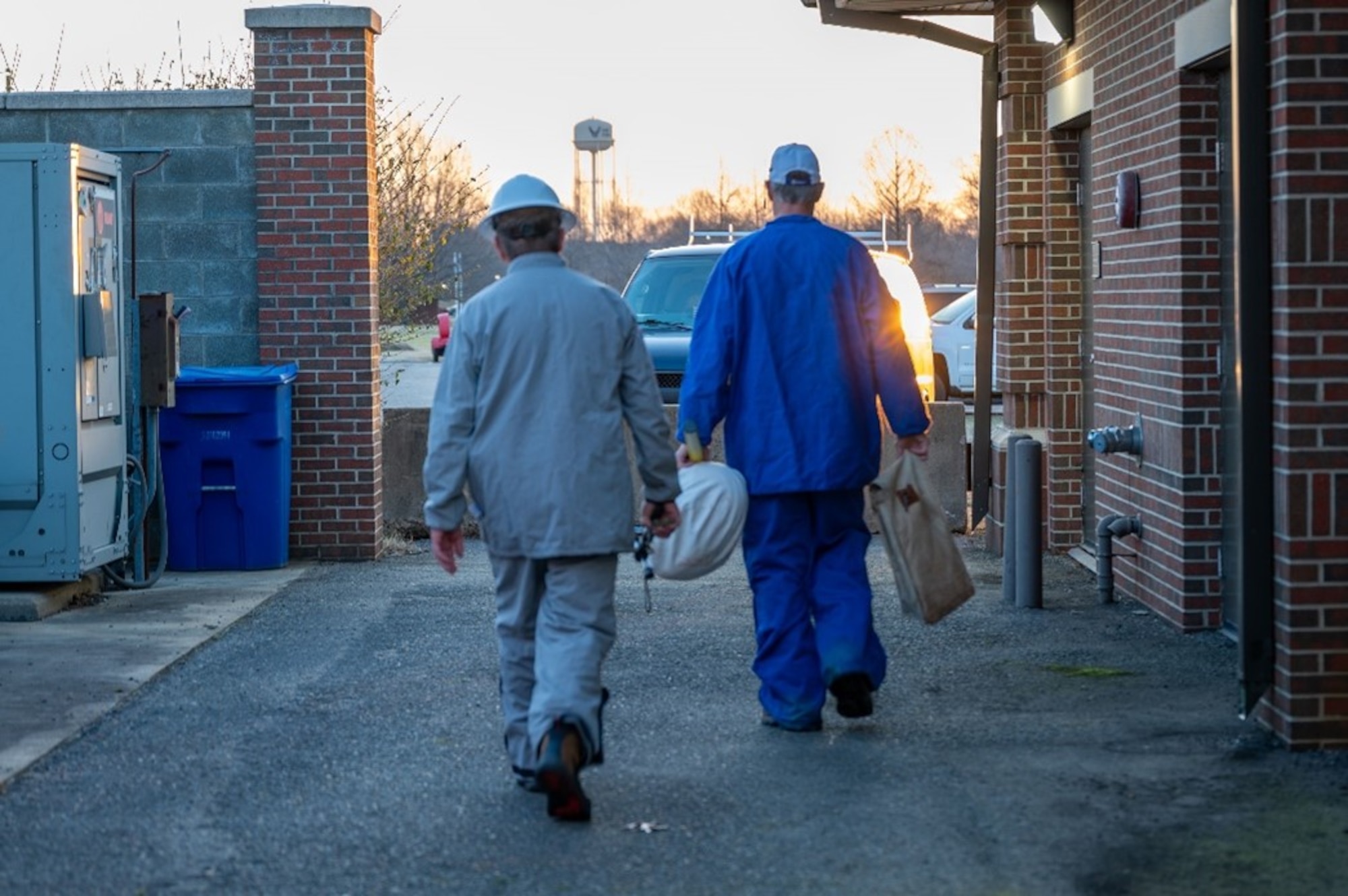 Two men walk towards parking lot. (U.S. Air Force photo by Airman 1st Class Donnell Ramsey)