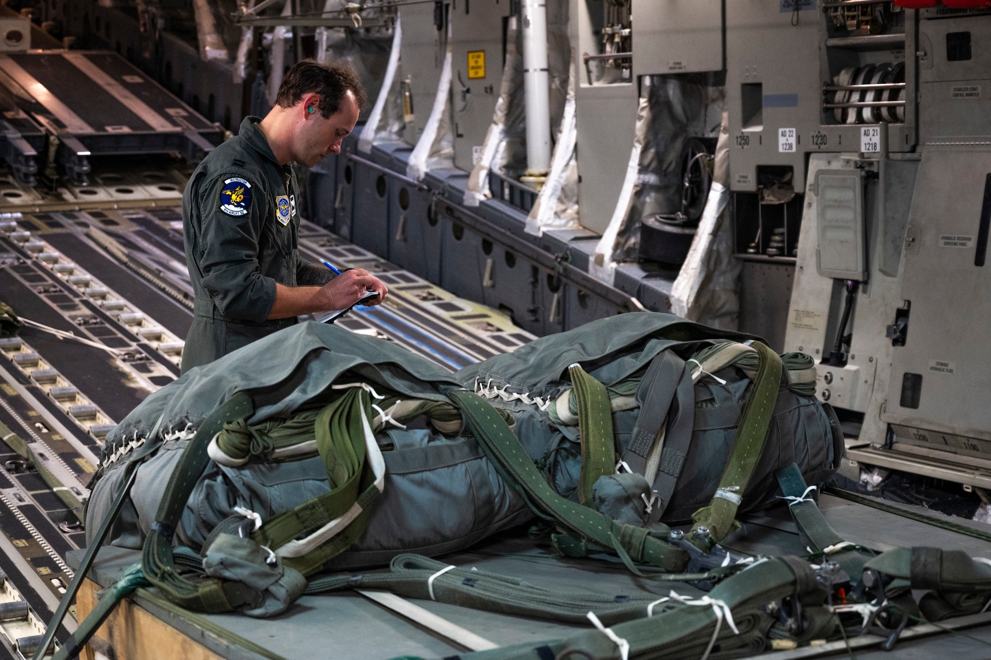 U.S. Air Force Capt. Christopher Culp-Cano, 8th Airlift Squadron pilot, conducts preflight checks at Joint Base Lewis-McChord, Washington, March 18, 2025.