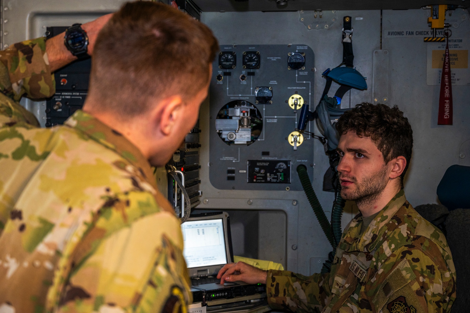 U.S. Air Force Senior Airman Matthew Ramos, left, and Airman 1st Class Nathaniel Roader, both 7th Airlift Squadron loadmasters, conduct preflight checks at Joint Base Lewis-McChord, Washington, March 18, 2025.