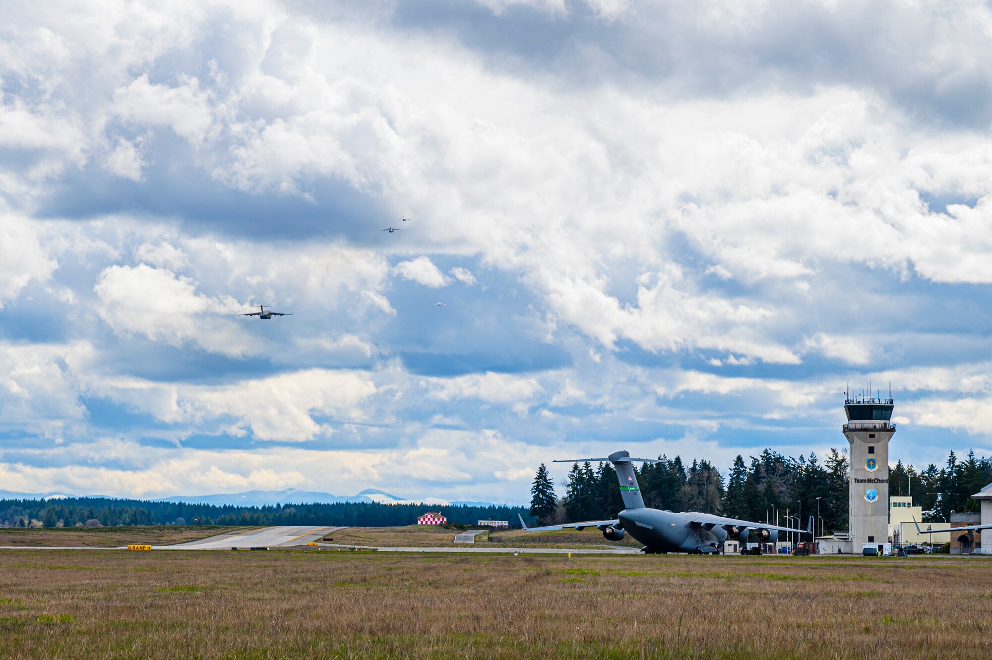 Four C-17 Globemaster IIIs depart from Joint Base Lewis-McChord, Washington, March 18, 2025.