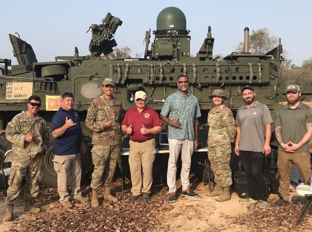 PMTEC team members, including Dr Andre Stridiron, Pacific Multi-Domain Training and Experimentation Capability Program Manager, meet with Cobra Gold 2025 Counter-UAS participants at the Phu Lam Yai Training Area, Thailand