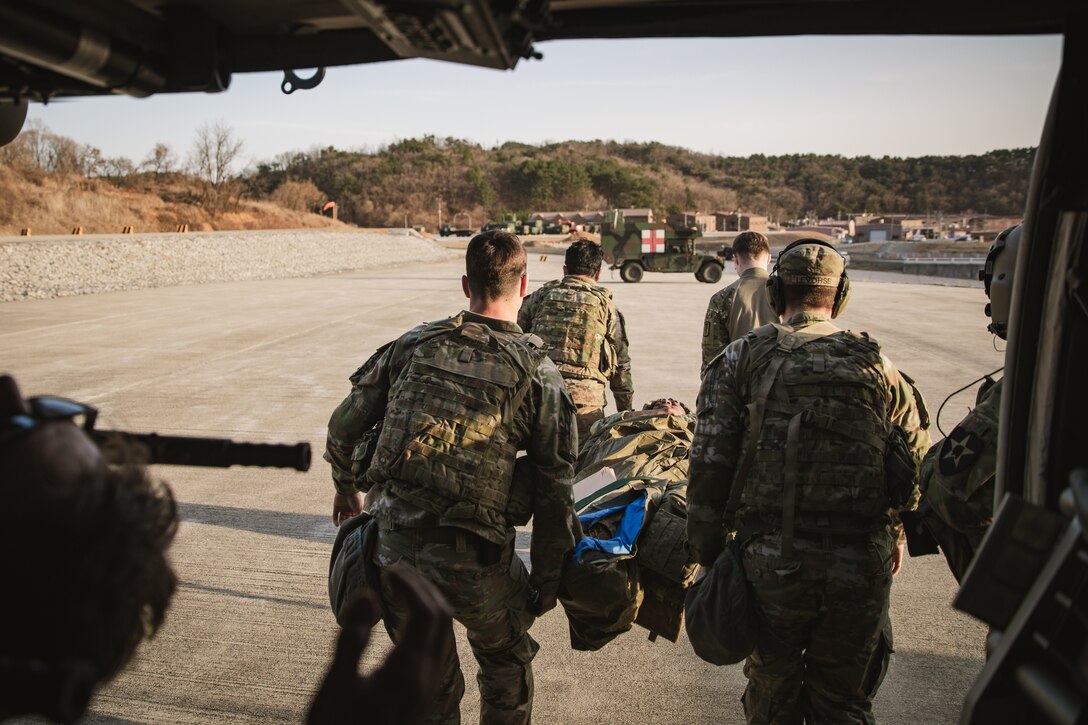 U.S. Army soldiers assigned to 560th Medical Company Ground Ambulance, 65th Medical Brigade perform medical evacuation roles during Freedom Lift at Rodriguez Live Fire Complex, South Korea, March 13, 2025.