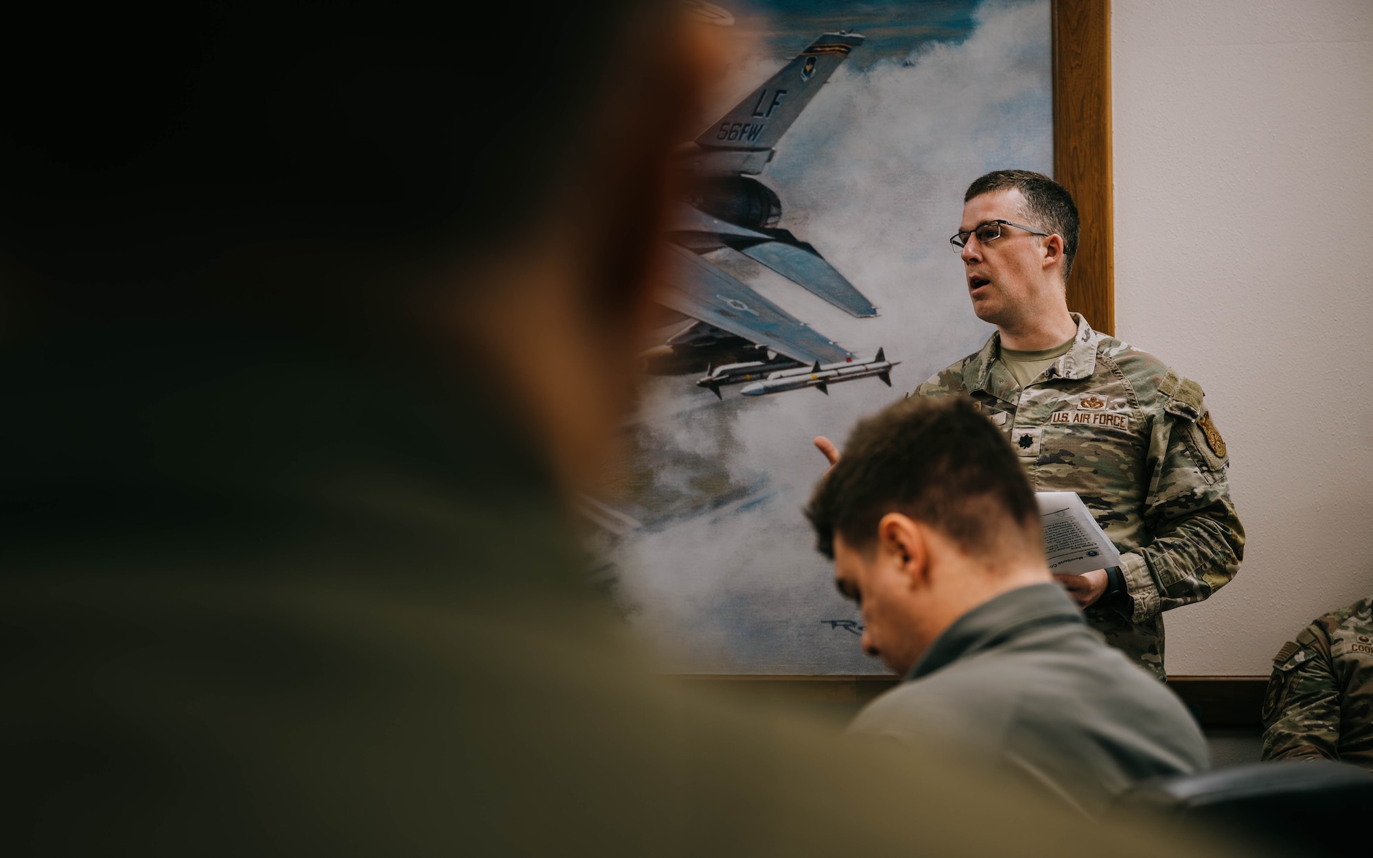 U.S. Air Force Lt. Col. John Marshall, 56th Civil Engineer Squadron commander, briefs Arizona Legislative representatives on funding requests.