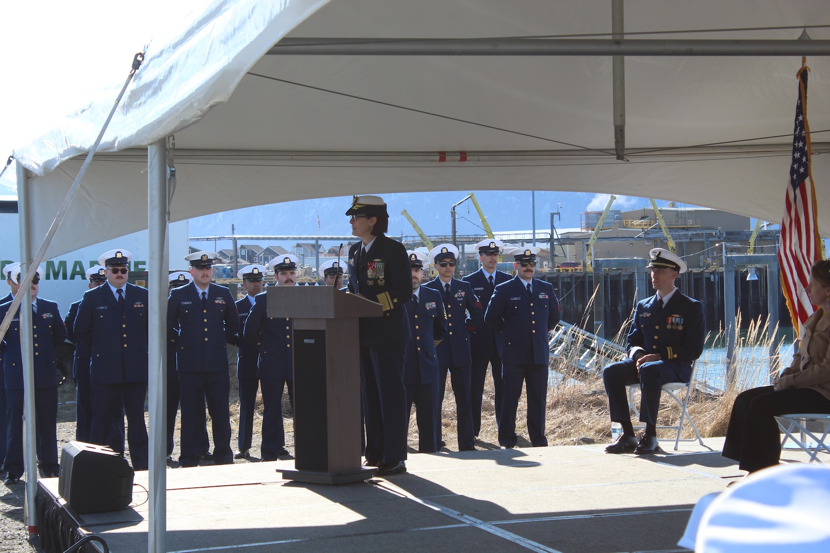 Rear Adm. Megan Dean, commander of Coast Guard District 17, and Coast Guard Cutter Naushon (WPB 1311) crewmembers presenting an award during the Naushon decommissioning ceremony in Homer, Alaska, March 21, 2025. Naushon has been stationed in Homer since 2016 and has since responded to over 50 search-and-rescue cases and completed nearly 900 law enforcement sorties. - U.S. Coast Guard photo by Seam Sydney Sharpe