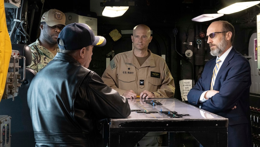 Acting Secretary of the Navy Terence Emmert, right, visits the amphibious assault ship USS Wasp (LHD 1) and the Arleigh Burke-class guided-missile destroyer USS Ross (DDG 71) at Naval Station Norfolk, March 20, 2025.
