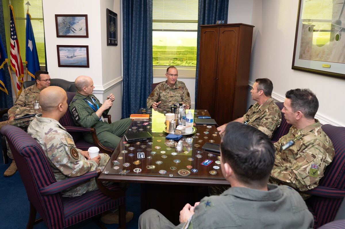 Lt. Gen. John Healy sits with leaders