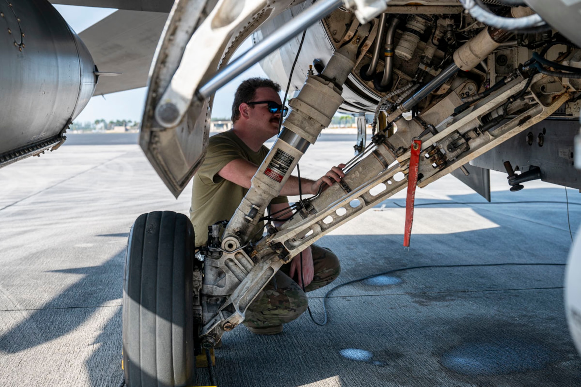 U.S. Air Force Senior Airman Zachary Tate, 849th Aircraft Maintenance crew chief, performs pre-flight checks on a U.S. Air Force F-16 Fighting Falcon at Holloman Air Reserve Base, Florida, March 13, 2025. Conducting a Large Force Exercise allows personnel to focus on enhancing readiness, adaptability, and cross-unit collaboration among Airmen, pilots, and maintenance teams. (U.S. Air Force photo by Senior Airman Michelle Ferrari)