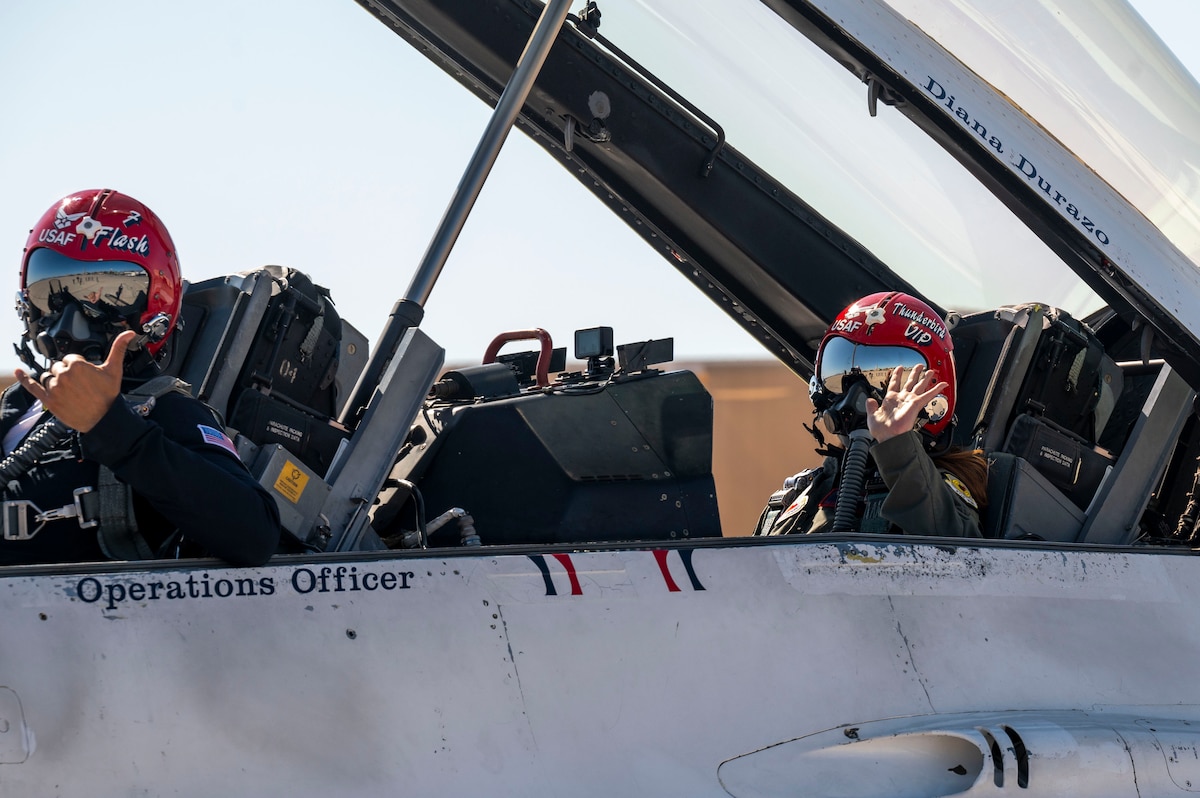 U.S. Air Force Lt. Col. Taylor Wight, United States Air Force Air Demonstration Squadron "Thunderbirds” director of operations, Thunderbird 7, and Diana Durazo, Pima County Administrator’s Office senior advisor and Tucson Hometown Hero, wave as they prepare for take off at Davis-Monthan Air Force Base, Arizona, March 21, 2025. Durazo was recognized for her support to DM, land conservation, educational institutions, civic groups and the local community by being named Tucson’s Hometown Hero. (U.S. Air Force photo by Airman Samantha Melecio)