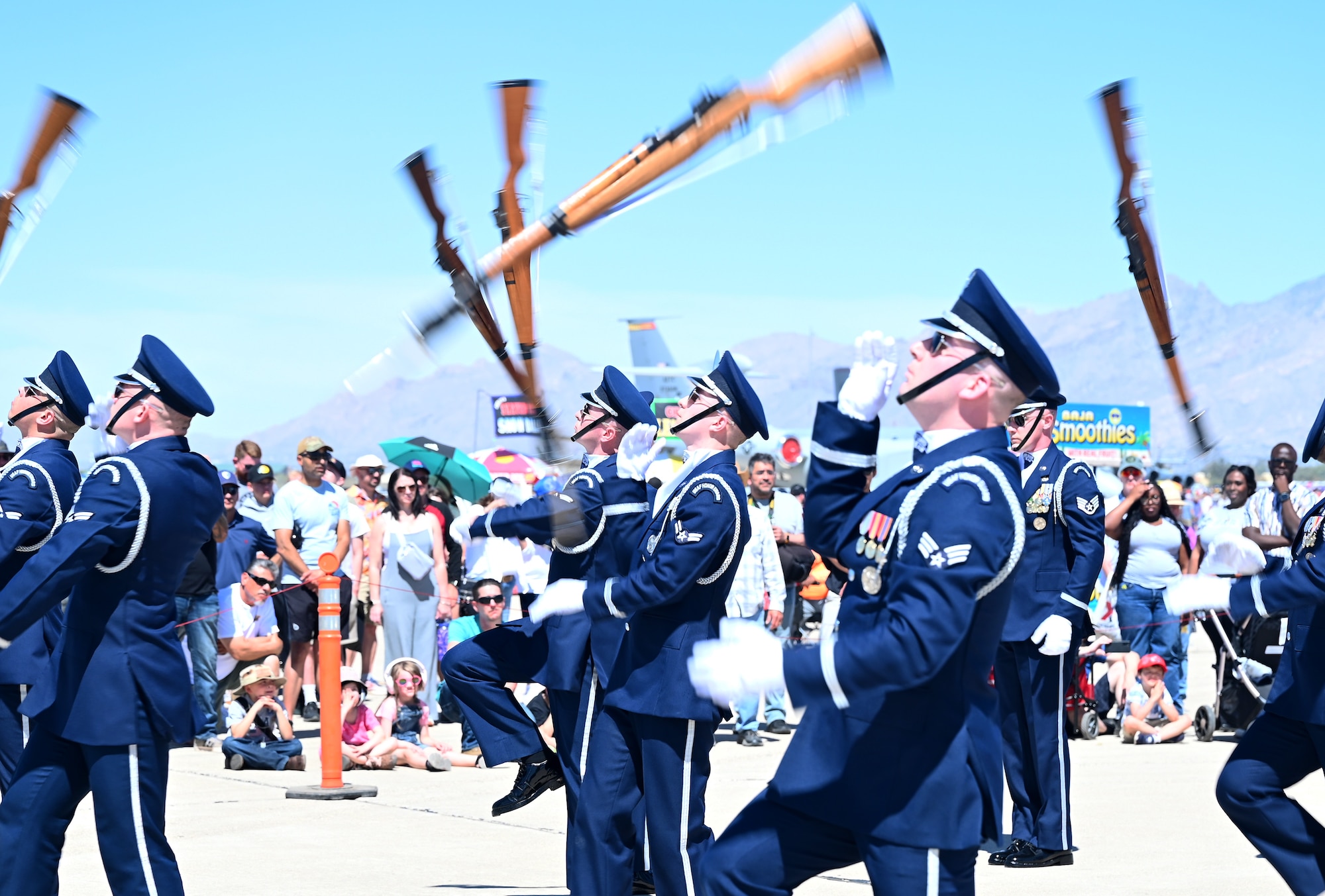 Members of the U.S. Air Force Honor Guard Drill Team perform at Davis-Monthan Air Force Base, Arizona, March 22, 2025. The Drill Team promotes the Air Force mission by showcasing drill performances at public and military venues to recruit, retain and inspire Airmen. (U.S. Air Force photo by Senior Airman Andrew Garavito)
