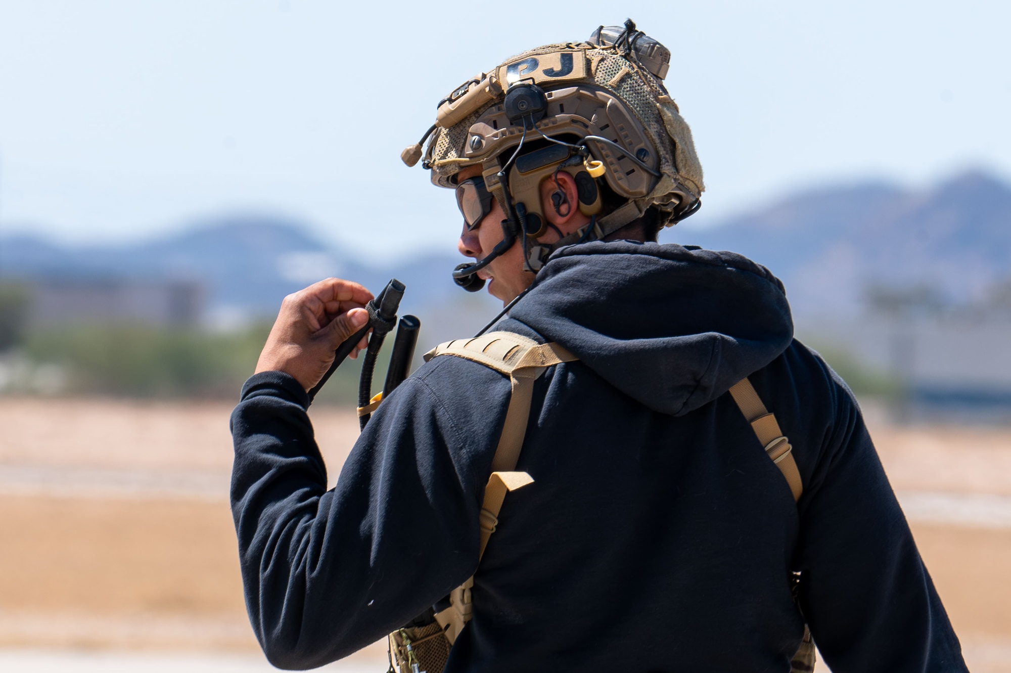 A U.S. Air Force pararescueman prepares to participate in a combat search and rescue demonstration during the Thunder and Lightning Over Arizona Air Show at Davis-Monthan Air Force Base, Arizona, March 22, 2025. The air show provided an opportunity for the local community to see the Department of Defense’s capabilities firsthand. (U.S. Air Force photo by Senior Airman Jasmyne Bridgers-Matos)