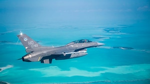 A U.S. Air Force F-16 Fighting Falcon assigned to Holloman Air Force Base flies over Key West during a Large Force Exercise at Homestead Air Reserve Base, Florida, March 13, 2025. The LFE provided invaluable exposure to new environments and equipment, enabling Airmen to adapt quickly and efficiently, enhancing their ability to deploy, operate, and troubleshoot in dynamic and ever-changing conditions. (U.S. Air Force photo by Senior Airman Michelle Ferrari)