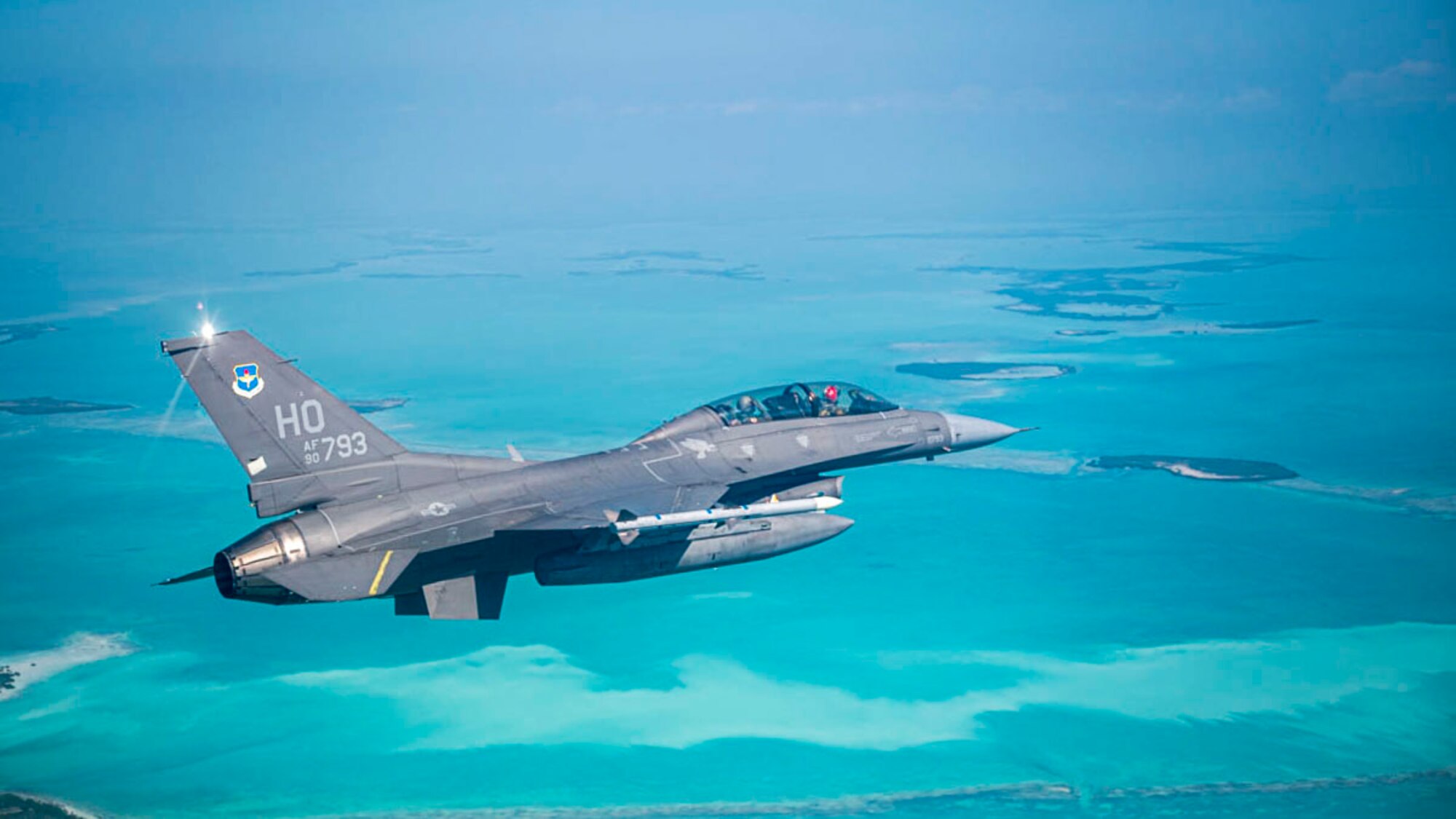A U.S. Air Force F-16 Fighting Falcon assigned to Holloman Air Force Base flies over Key West during a Large Force Exercise at Homestead Air Reserve Base, Florida, March 13, 2025. The LFE provided invaluable exposure to new environments and equipment, enabling Airmen to adapt quickly and efficiently, enhancing their ability to deploy, operate, and troubleshoot in dynamic and ever-changing conditions. (U.S. Air Force photo by Senior Airman Michelle Ferrari)