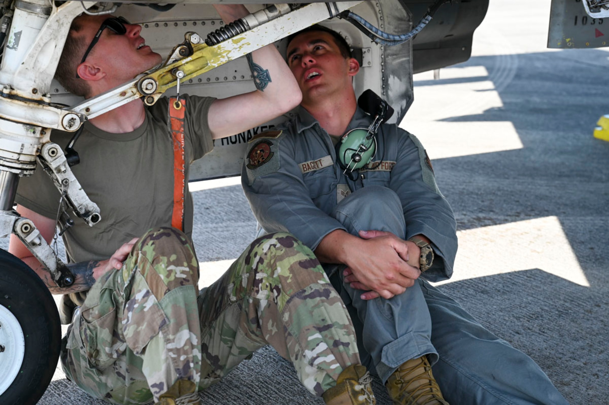 U.S. Air Force Senior Airman Isaac Baggett, 8th Aircraft Maintenance Unit avionics journeyman, left, and Staff Sgt. Christopher Ransom, 8th AMU specialist expeditor, inspects a U.S. Air Force F-16 Fighting Falcon at Homestead Air Reserve Base, Florida, March 10, 2025. Conducting a Large Force Exercise allows personnel to focus on enhancing readiness, adaptability, and cross-unit collaboration among Airmen, pilots, and maintenance teams. (U.S. Air Force photo by Senior Airman Michelle Ferrari)