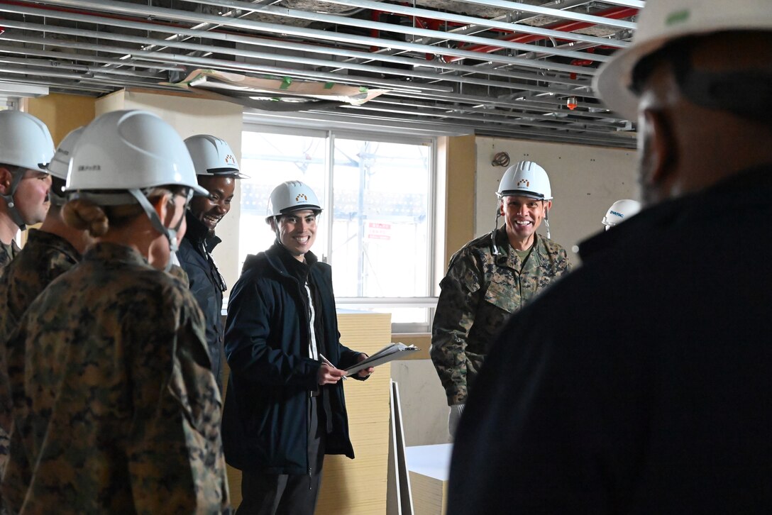 (Left to right) Ihejirika Agomuoh, camp facilities management officer and Pedro Cardenas, installation planner, stand next to U.S. Marine Corps Sgt. Maj. Carlos A. Ruiz, the sergeant major of the Marine Corps, during a tour of a construction project for permanent party junior Marines’ barracks at Combined Arms Training Center, Camp Fuji, Japan, March 21, 2025. It is his fourth visit to the INDOPACOM as the SMMC. (U.S. Marine Corps photo by Song Jordan)