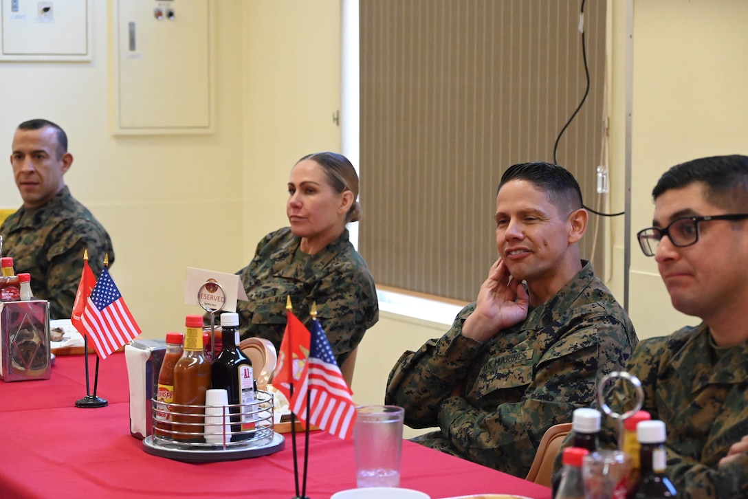 (Left to right) U.S. Marine Corps Master Sgt. Edward Martinez, mess hall manager, Sgt. Maj. Joy Kitashima, sergeant major of III Marine Expeditionary Force, Sgt. Maj. Carlos A. Ruiz, sergeant major of the Marine Corps, and Gunnery Sgt. Juan Hernandez, Camp Fuji Headquarters and Services Company first sergeant listen to a Marine during lunch.  (U.S. Marine Corps photo by Song Jordan)