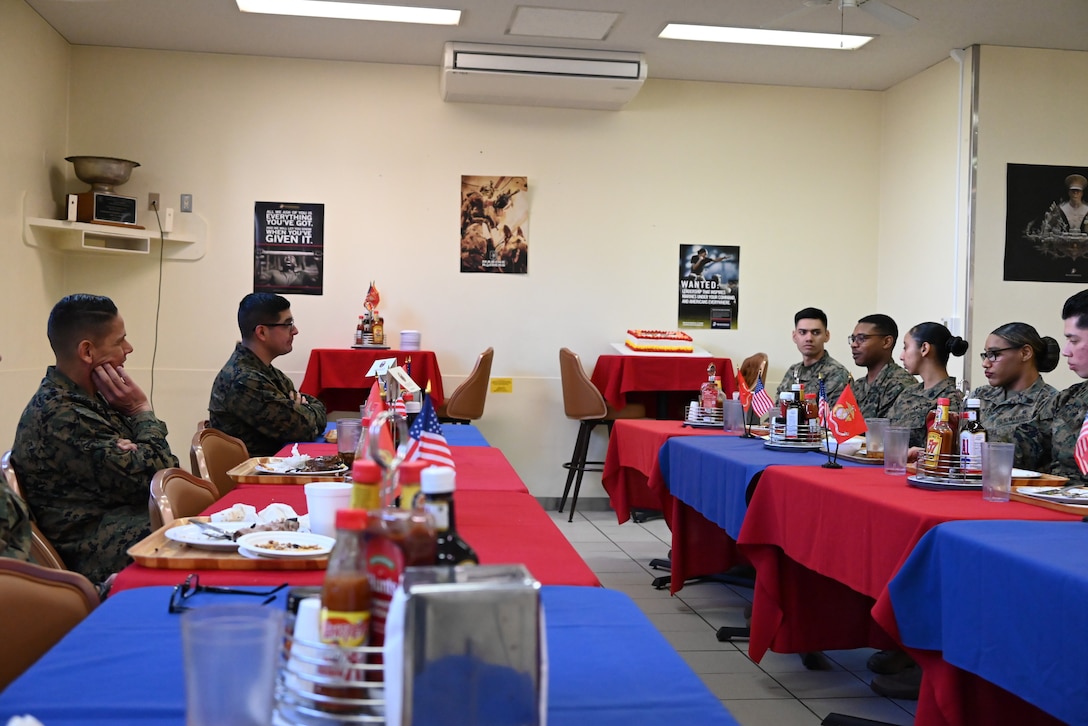 U.S. Marine Corps Sgt. Maj. Carlos A. Ruiz, the sergeant major of the Marine Corps, visited Marines, sailors, and staff at Combined Arms Training Center, Camp Fuji, Japan, March 21, 2025. It is his fourth visit to the INDOPACOM as the SMMC. Ruiz listens to a Marine during lunch.  (U.S. Marine Corps photo by Song Jordan)