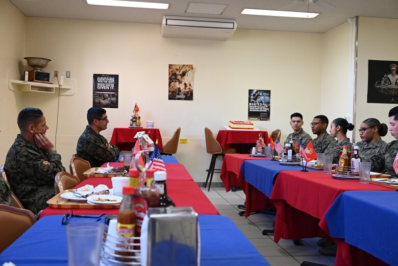 U.S. Marine Corps Sgt. Maj. Carlos A. Ruiz, the sergeant major of the Marine Corps, listens to a Marine.