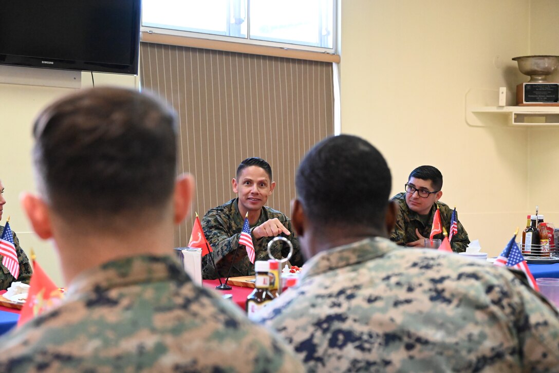 U.S. Marine Corps Sgt. Maj. Carlos A. Ruiz, the sergeant major of the Marine Corps, visited Marines, sailors, and staff at Combined Arms Training Center, Camp Fuji, Japan, March 21, 2025. It is his fourth visit to the INDOPACOM as the SMMC. Ruiz answers a Marine’s question during lunch. (U.S. Marine Corps photo by Song Jordan)
