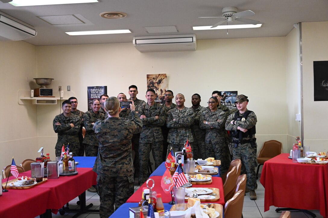 U.S. Marine Corps Sgt. Maj. Carlos A. Ruiz, the sergeant major of the Marine Corps, visited Marines, sailors, and staff at Combined Arms Training Center, Camp Fuji, Japan, March 21, 2025. It is his fourth visit to the INDOPACOM as the SMMC. Ruiz (center front) poses for a group photo after lunch with Marines. listens to a Marine's feedback during his visit. (U.S. Marine Corps photo by Song Jordan)