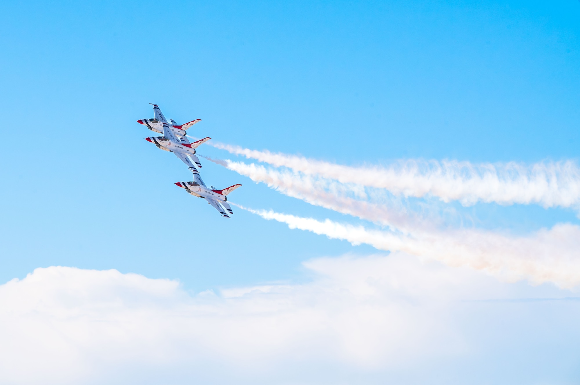 The U.S. Air Force Air Demonstration Squadron “Thunderbirds” fly during the Thunder and Lightning Over Arizona Air Show at Davis-Monthan Air Force Base, Arizona, March 23, 2025. The Thunderbirds fly in formation, as well as solo maneuvers, to highlight precision flying and the combat capabilities of the U.S. Air Force. (U.S. Air Force photo by Senior Airman Jasmyne Bridgers-Matos)
