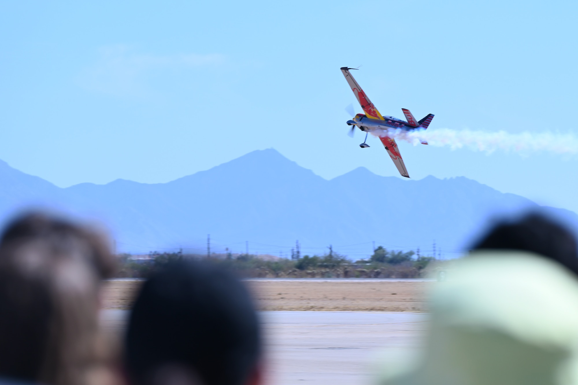 Kirby Chambliss and the Red Bull Air Force fly overhead during the Thunder and Lightning Over Arizona Air Show at Davis-Monthan Air Force Base, Arizona, March 23, 2025. DM hosted aerial demonstrations, static displays and featured the U.S. Air Force Air Demonstration Squadron “Thunderbirds”. (U.S. Air Force photo by Senior Airman Andrew Garavito)