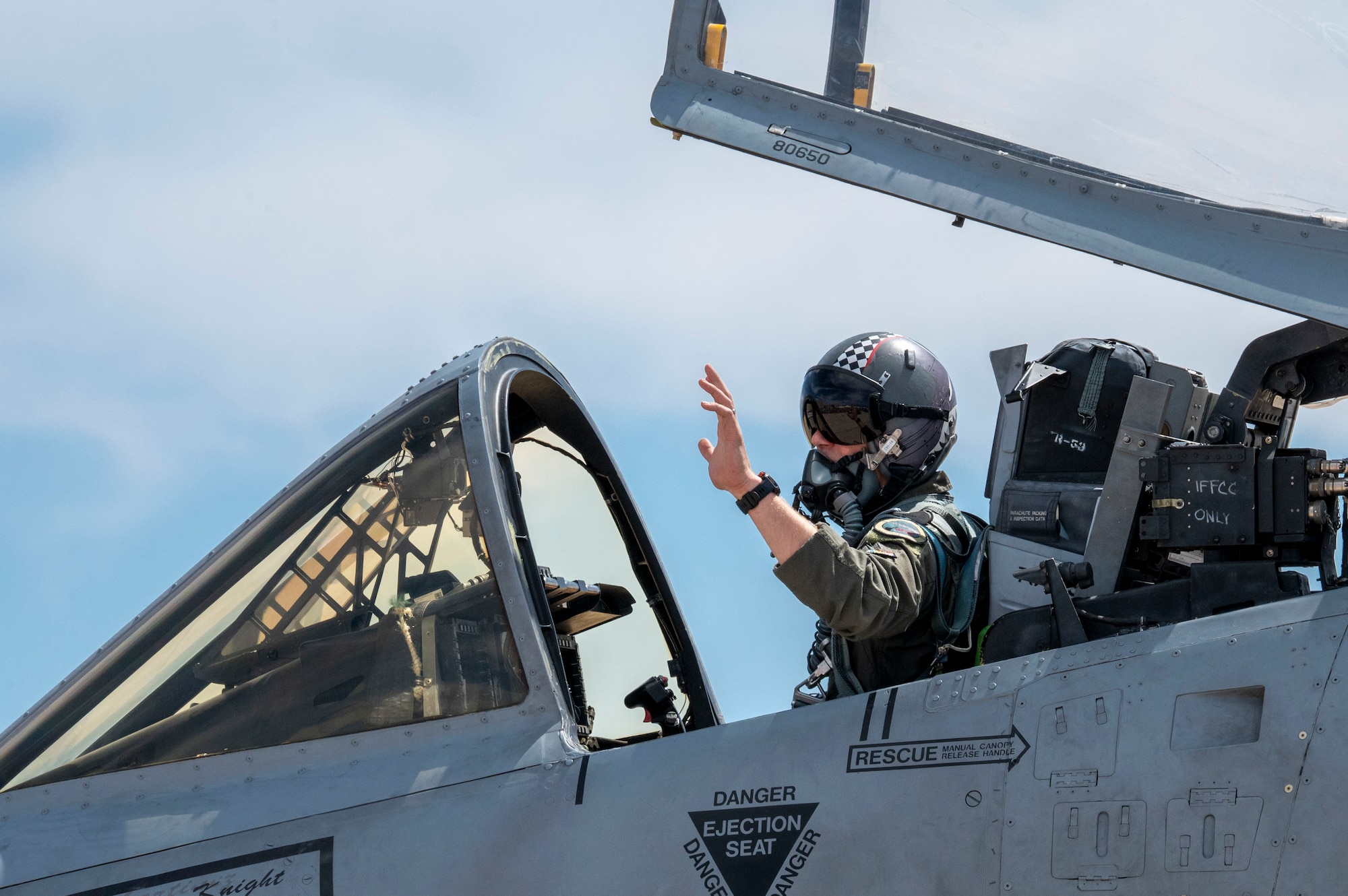 U.S. Air Force Maj. Tyler “SIMPLE” Samp, 357th Fighter Squadron instructor pilot, waves to the crowd from an A-10C Thunderbolt II aircraft during the Thunder and Lightning Over Arizona Air Show at Davis-Monthan Air Force Base, Arizona, March 23, 2025. The A-10C participated in a combat search and rescue demonstration at the airshow. (U.S. Air Force photo by Airman Samantha Melecio)
