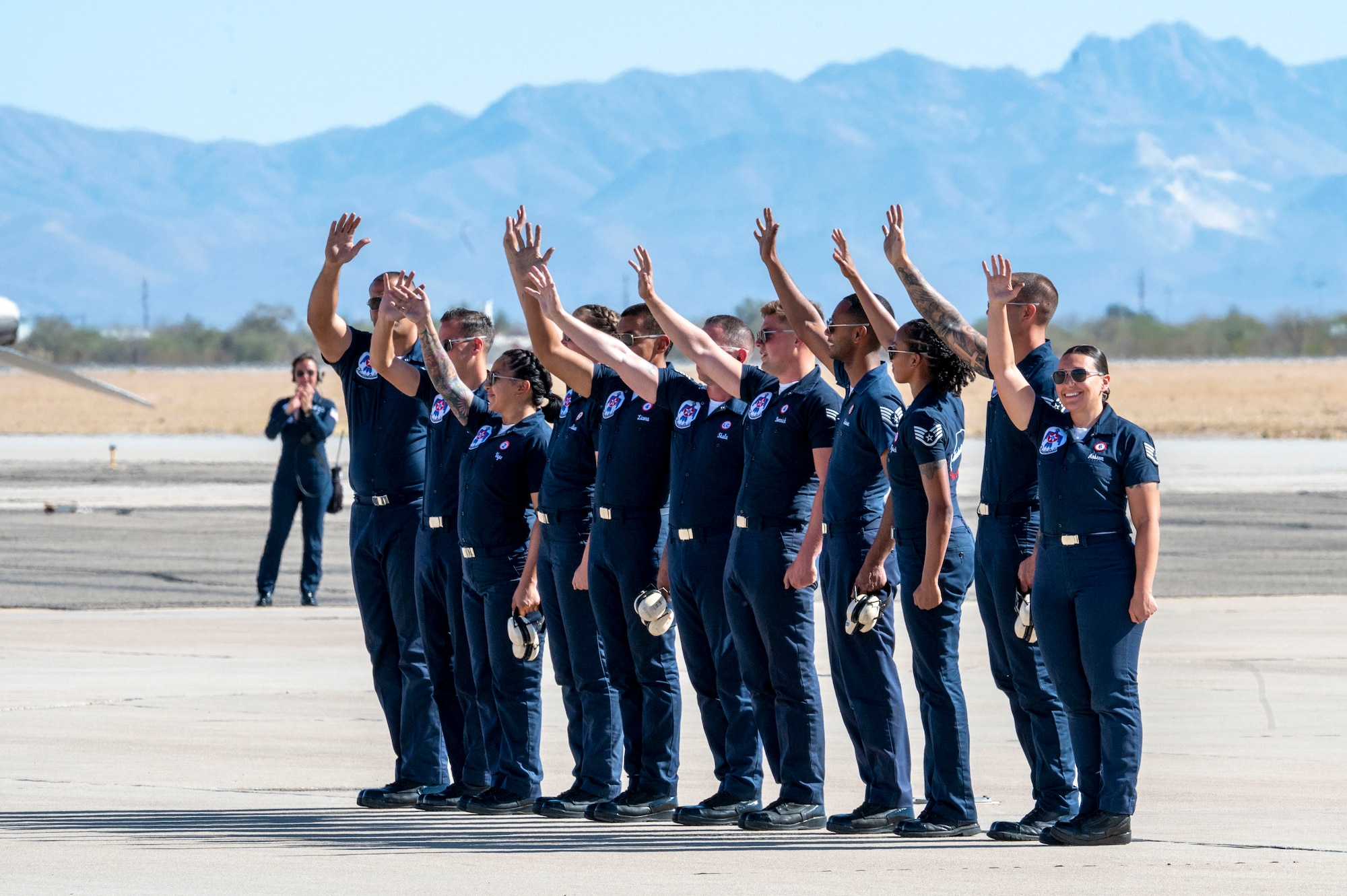 The U.S. Air Force Air Demonstration Squadron “Thunderbirds” wave to the crowd during the 2025 Thunder and Lightning Over Arizona Air Show at Davis-Monthan Air Force Base, Arizona, March 23, 2025. The Thunderbirds consist of eight pilots, four support officers, three civilians and over 120 enlisted personnel. (U.S. Air Force photo by Airman Samantha Melecio)