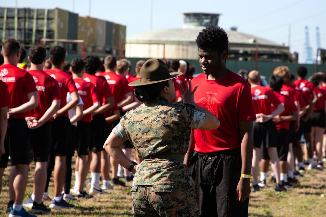 Sgt. Nataly Azanzamontoya, drill instructor from Marine Corps Recruit Depot Parris Island, prepares individuals scheduled for boot camp during a Marine Corps Recruiting Station Jacksonville pool function March 22 at Marine Corps Support Facility Blount Island in Jacksonville, Florida. Roughly 275 young men and women from across Florida and Georgia participated in the annual event, designed to assess the physical and mental readiness of future recruits before they ship to boot camp.