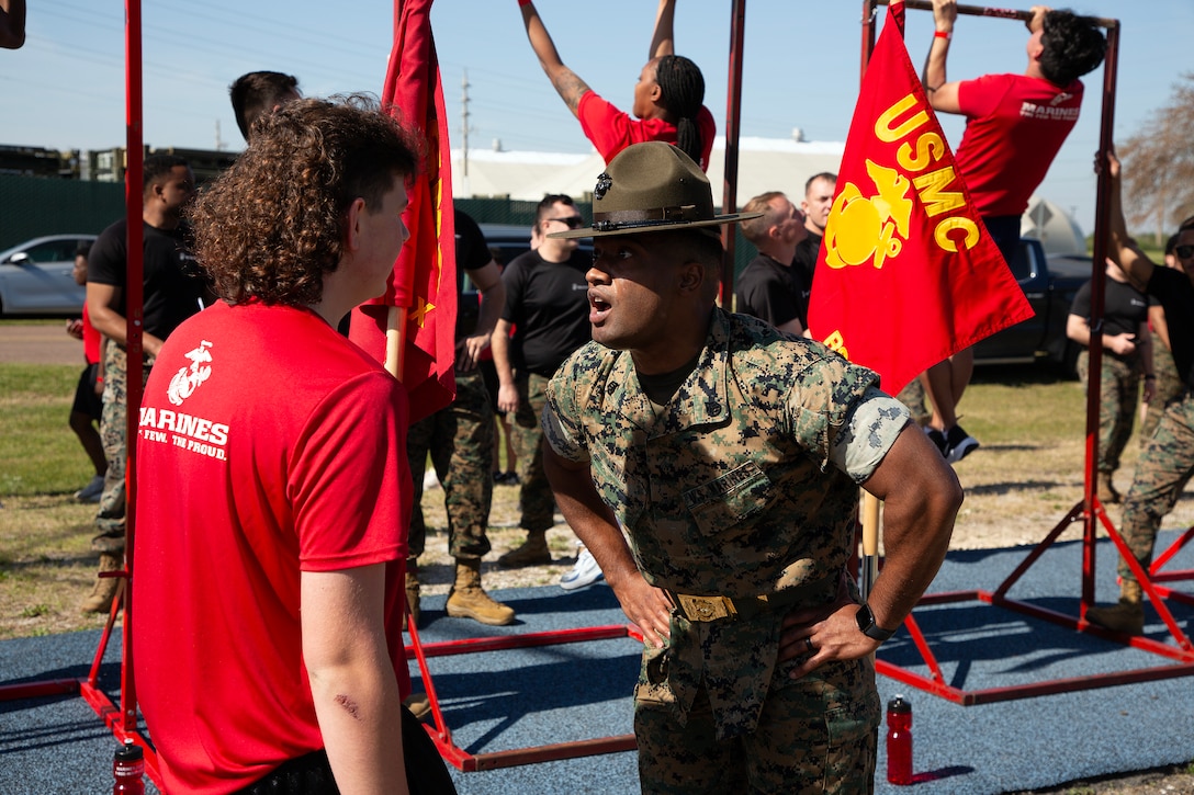 Staff Sgt. Arkeevin Lewis, drill instructor from Marine Corps Recruit Depot Parris Island, prepares individuals scheduled for boot camp during a Marine Corps Recruiting Station Jacksonville pool function March 22 at Marine Corps Support Facility Blount Island in Jacksonville, Florida. Roughly 275 young men and women from across Florida and Georgia participated in the annual event, designed to assess the physical and mental readiness of future recruits before they ship to boot camp.
