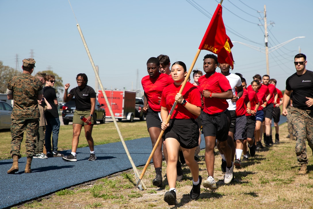 Individuals scheduled for boot camp run in formation during a Marine Corps Recruiting Station Jacksonville pool function March 22 at Marine Corps Support Facility Blount Island in Jacksonville, Florida. Roughly 275 young men and women from across Florida and Georgia participated in the annual event, designed to assess the physical and mental readiness of future recruits before they ship to boot camp.