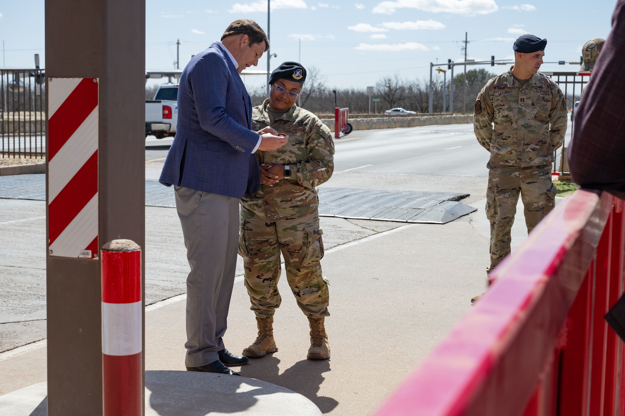 Congressman Jodey Arrington presents Staff Sgt. Dianiche Baxtron, 7th Security Forces Squadron patrolman, with a coin at Dyess Air Force Base, Texas, March 19, 2025. Arrington visited Dyess to meet with base leadership to discuss a way forward supporting the base infrastructure and the future beddown of the B-21 Raider. (U.S. Air Force photo by Senior Airman Emma Anderson)