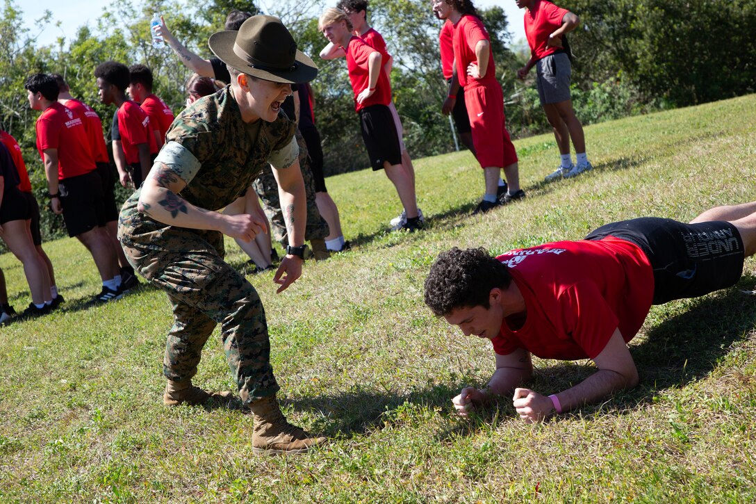 Sgt. Saraysophonh Thach, drill instructor from Marine Corps Recruit Depot Parris Island, prepares individuals scheduled for boot camp during a Marine Corps Recruiting Station Jacksonville pool function March 22 at Marine Corps Support Facility Blount Island in Jacksonville, Florida. Roughly 275 young men and women from across Florida and Georgia participated in the annual event, designed to assess the physical and mental readiness of future recruits before they ship to boot camp.