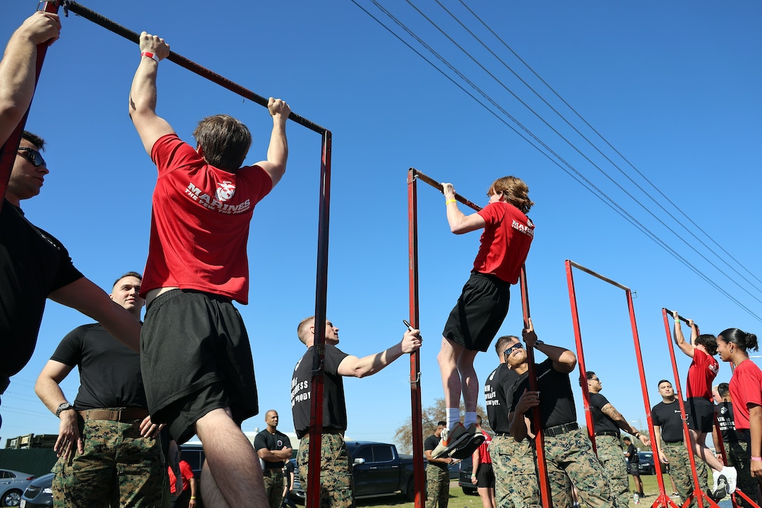 Individuals scheduled for boot camp complete an initial strength test during a Marine Corps Recruiting Station Jacksonville pool function March 22 at Marine Corps Support Facility Blount Island in Jacksonville, Florida. Roughly 275 young men and women from across Florida and Georgia participated in the annual event, designed to assess the physical and mental readiness of future recruits before they ship to boot camp.