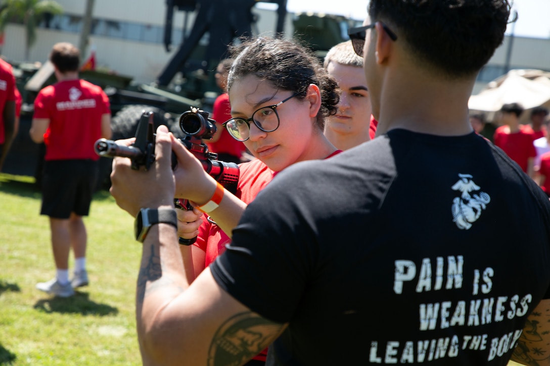 Individuals scheduled for boot camp learn about M4 rifle components during a Marine Corps Recruiting Station Jacksonville pool function March 22 at Marine Corps Support Facility Blount Island in Jacksonville, Florida. Roughly 275 young men and women from across Florida and Georgia participated in the annual event, designed to assess the physical and mental readiness of future recruits before they ship to boot camp.