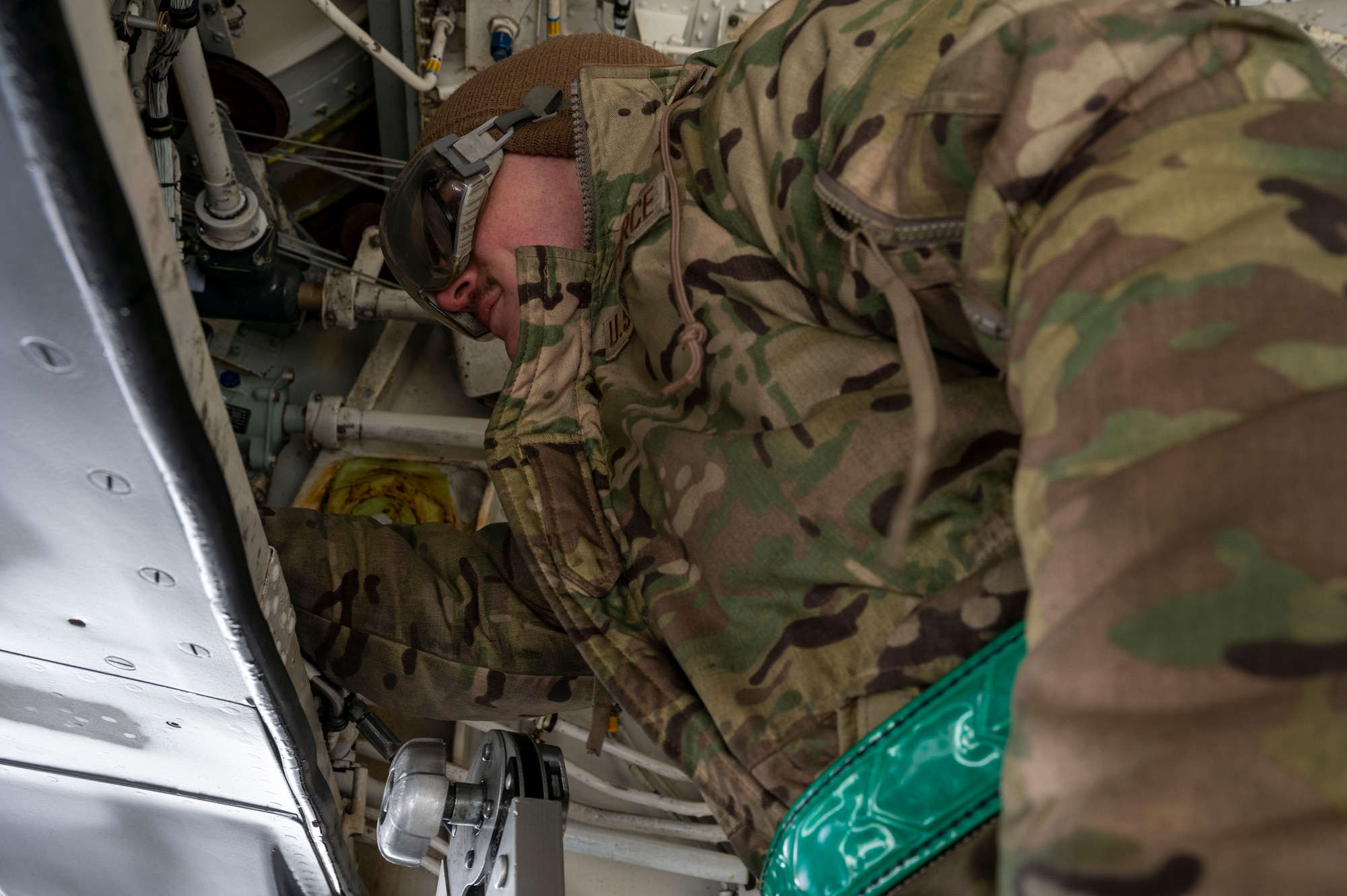 U.S. Air Force Senior Airman Stephen Taylor, a crew chief assigned to the 92nd Aircraft Maintenance Squadron, adds nitrogen to the hydraulic accumulator to help pressurize the aircraft during exercise Titan Fury 25-2 at Fairchild Air Force Base, Washington, March 17, 2025. Titan Fury is a total force readiness exercise designed to evaluate and enhance the operational skills of Team Fairchild’s Airmen, ensuring their ability to fuel today and tomorrow’s fight. (U.S. Air Force photo by Airman 1st Class Samantha Thorn)