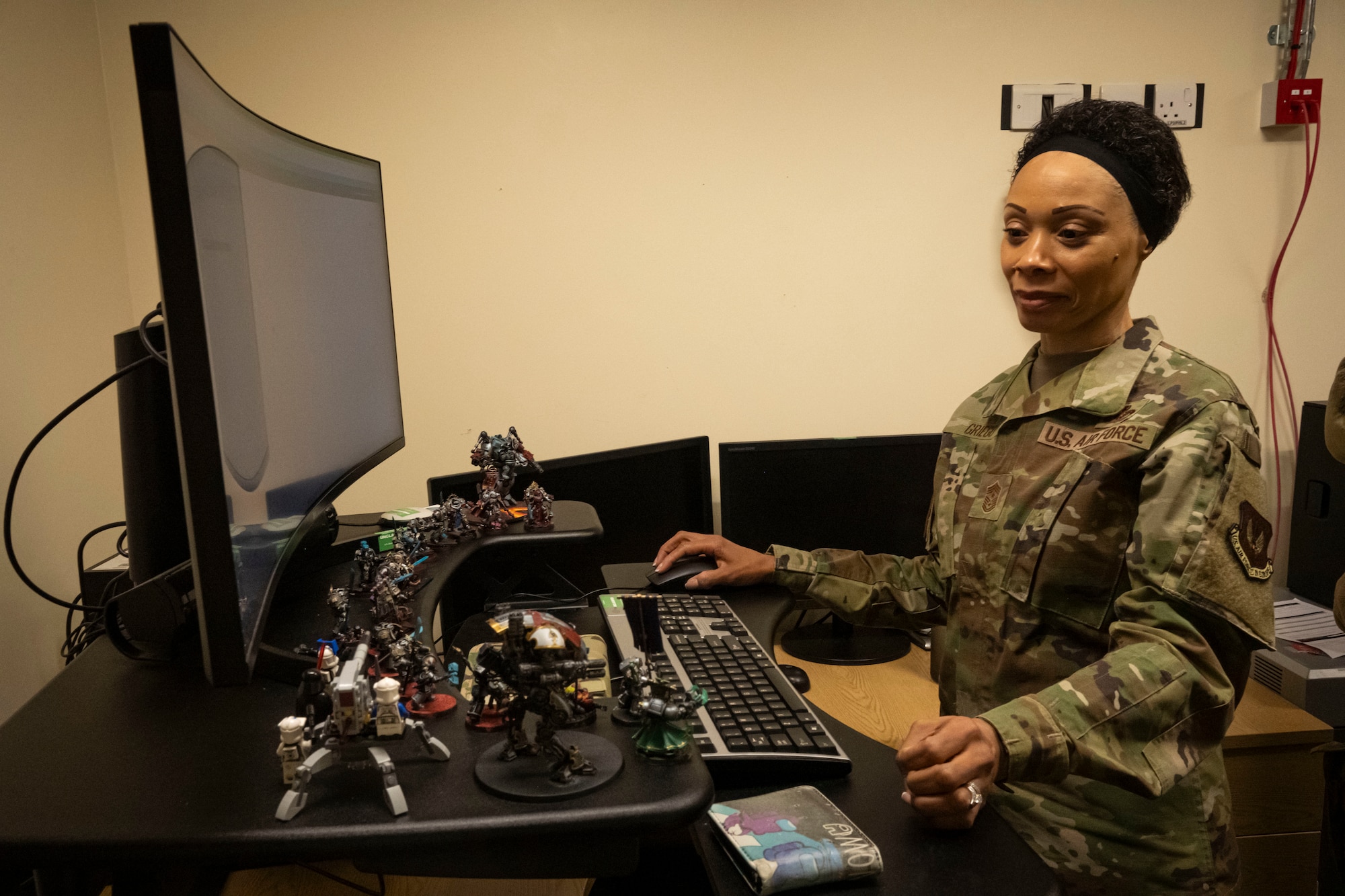 U.S. Air Force Chief Master Sgt. Tiffany Griego, 100th Air Refueling Wing command chief, navigates through 100th Communications Squadron programs at RAF Mildenhall, England, March 21, 2025.
