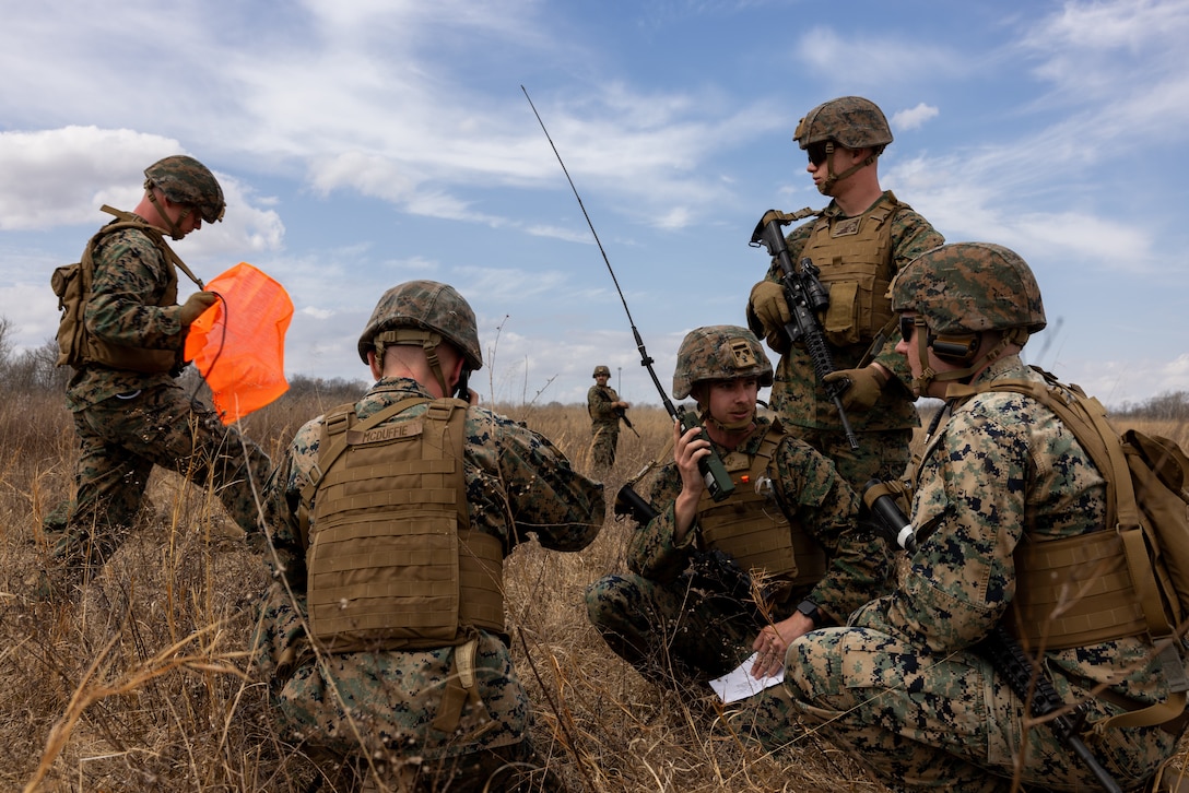 U.S. Marines with Communication Company, 14th Marine Regiment, 4th Marine Division, prepare for a casualty evacuation (CASEVAC) involving a simulated casualty for a joint communications exercise with the 38th Combat Aviation Brigade, Indiana National Guard in Camp Atterbury, Edinburgh, Indiana, March 14, 2025.
