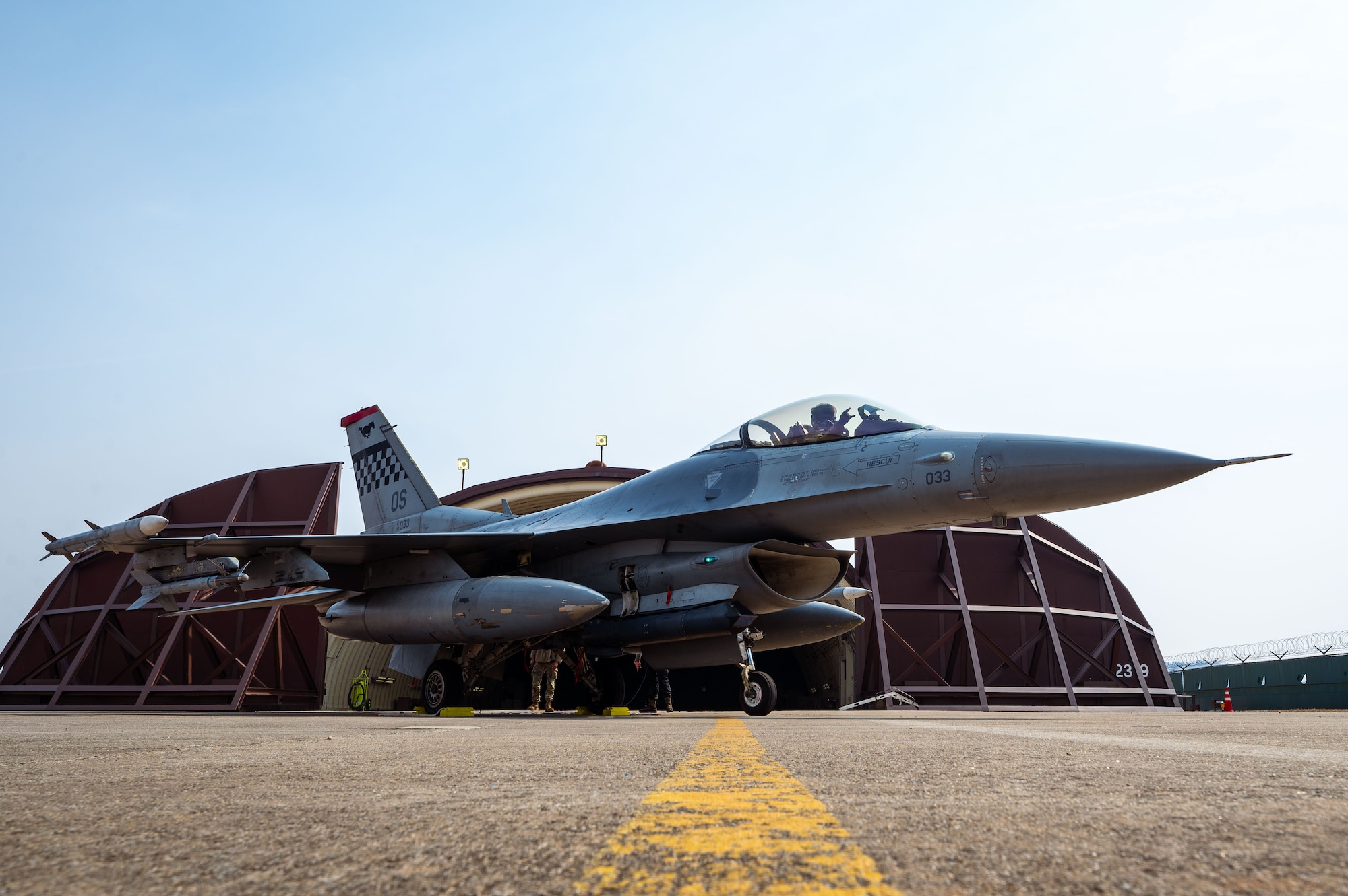 A U.S. Air Force pilot assigned to the 36th Fighter Squadron poses in an F-16 Fighting Falcon aircraft at Suwon Air Base, South Korea, March 7, 2025. F-16s arrived for bed down in preparation for Exercise Freedom Shield 25. (U.S. Air Force photo by Senior Airman Jasmyne Bridgers-Matos)