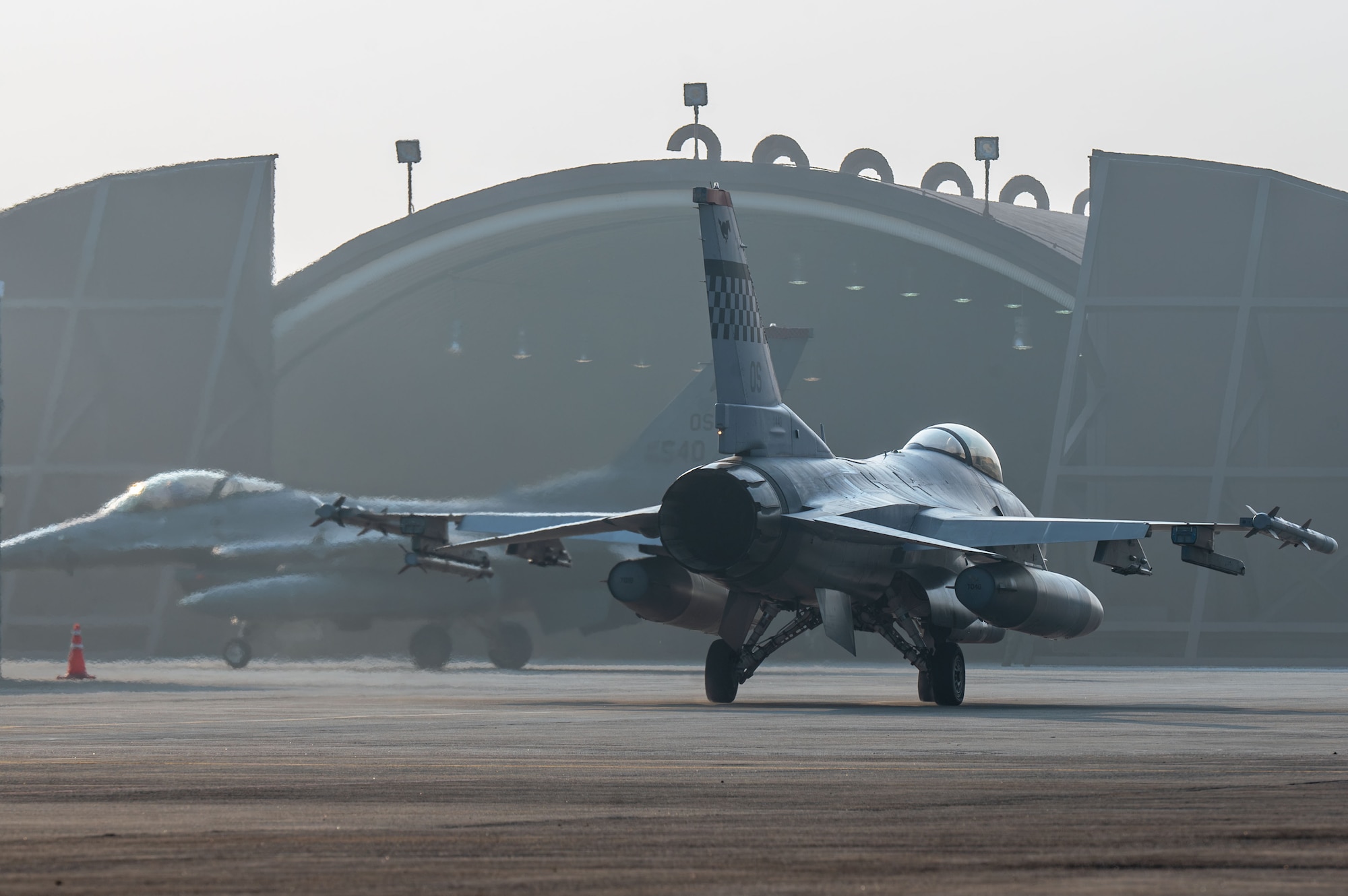 Two U.S. Air Force F-16 Fighting Falcon aircraft assigned to the 36th Fighter Squadron taxi to the flight line during Freedom Shield 25, at Suwon Air Base, South Korea, March 10, 2025. During the exercise, Seventh Air Force units and the 11th Air Task Force employed agile combat employment concepts, demonstrating their ability to generate, project and sustain airpower from dispersed locations across the region. (U.S. Air Force photo by Senior Airman Jasmyne Bridgers-Matos)