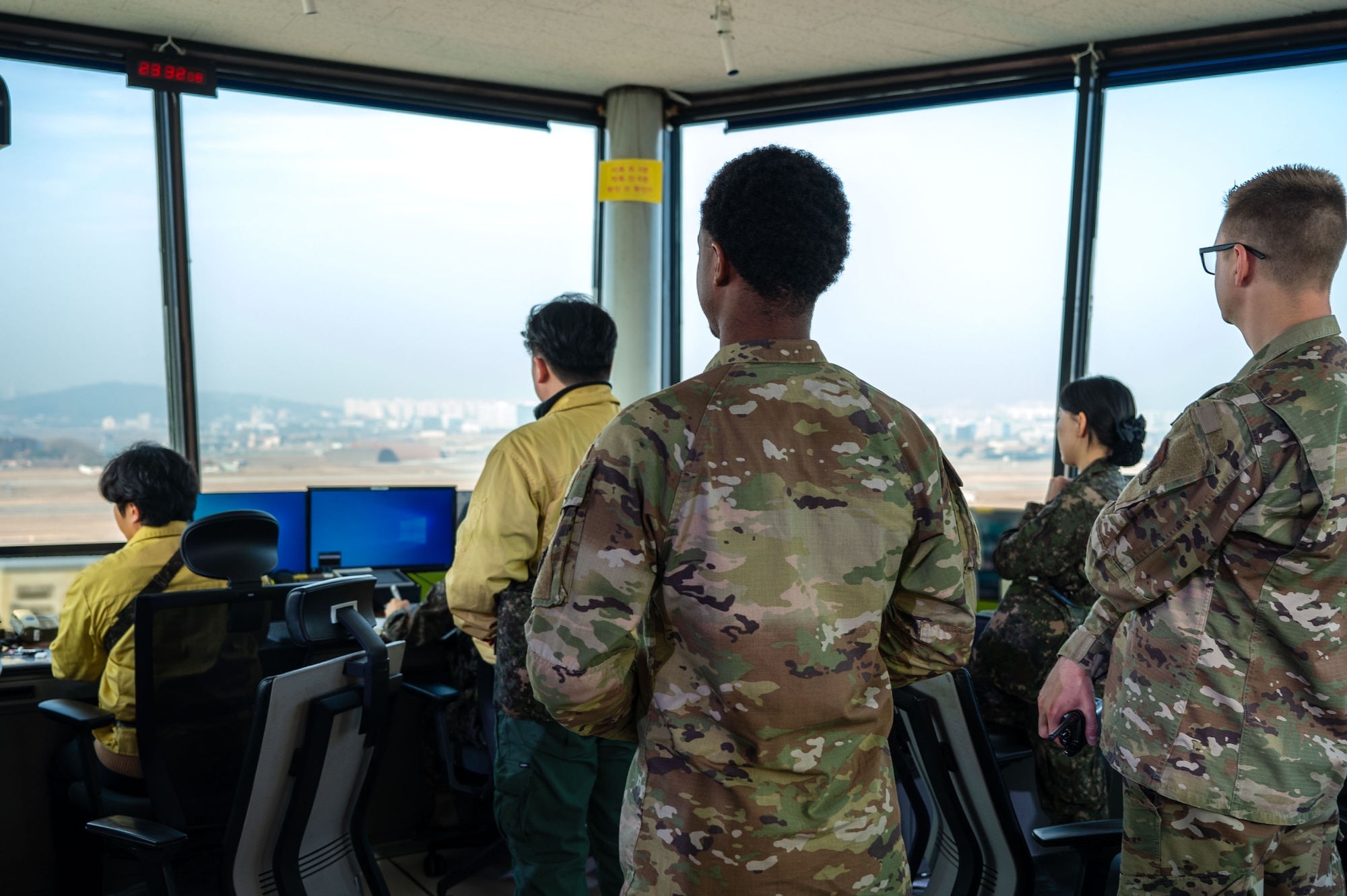 U.S. 11th Air Task Force Airmen and members of the Republic of Korea Air Force oversee flying operations from the air traffic control tower in support of Freedom Shield 25, at Suwon Air Base, South Korea, March 11, 2025. FS25, which features live, virtual, and field-based training, strengthens interoperability between U.S. and ROK forces while enhancing coordination across alliance military and governmental agencies. (U.S. Air Force photo by Senior Airman Jasmyne Bridgers-Matos)
