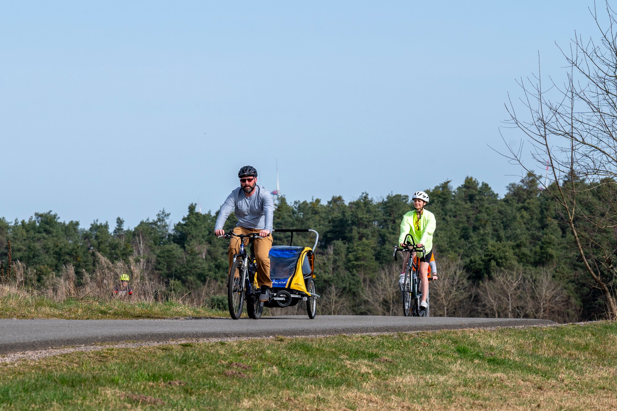 Participants of Grant’s Ride, an annual memorial ride in honor of U.S. Air Force Staff Sgt. Grant Davis, a member of the 76th Airlift Squadron, who passed away in a cycling accident, bike together to a roadside memorial near Ramstein Air Base, Germany, March 21, 2025.