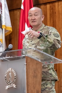Col. Eric Smith, of Springfield, thanks family, friends, and coworkers during a retirement ceremony March 21 at the Illinois Military Academy on Camp Lincoln, Springfield. Smith retired from the Illinois Army National Guard after 36 years of military service.