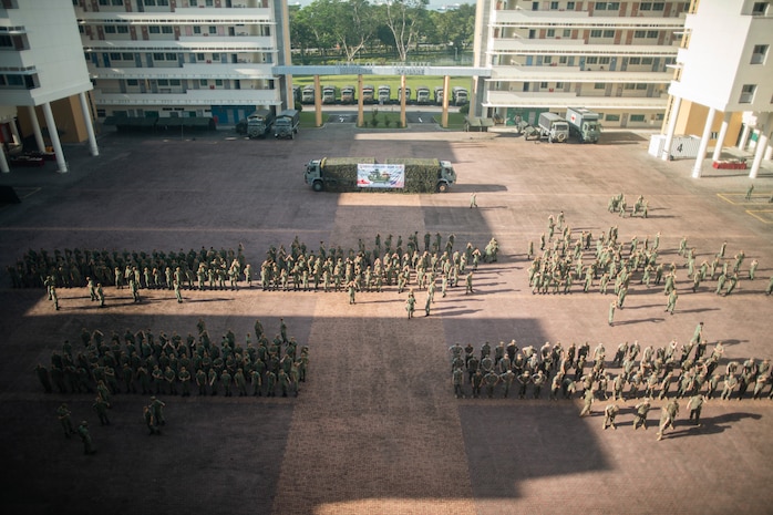 U.S. Marines attached to Marine Rotational Force-Southeast Asia, I Marine Expeditionary Force, alongside Singapore Guardsmen with 7th Singapore Infantry Brigade, stand-by for the opening ceremony for Valiant Mark 25 on Bedok Camp, Singapore, March 17, 2025. Valiant Mark is an annual, bilateral training exercise designed to enhance interoperability, build mutual defense capabilities, and strengthen military-to-military relationships between the U.S. Marine Corps and Singapore Armed Forces (U.S. Marine Corps photo by Sgt. Shaina Jupiter)